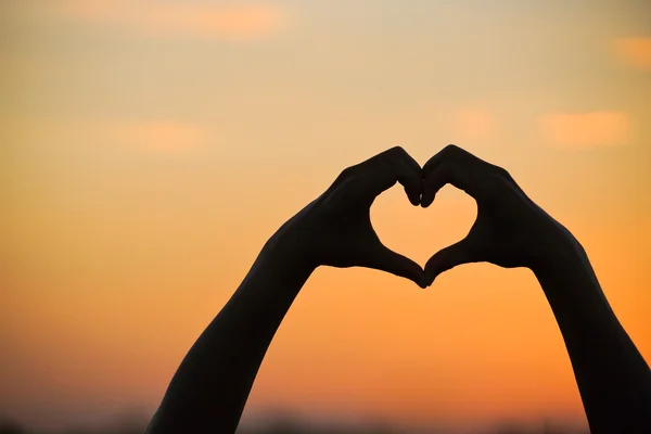 Heart symbol made with two hands — Stock Photo, Image