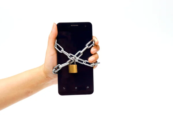 Hand holding a chained smartphone — Stock Photo, Image