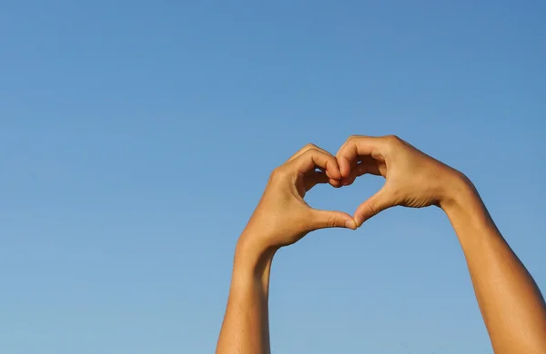 Heart symbol made with two hands — Stock Photo, Image