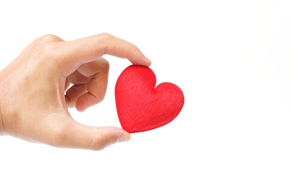 Mano sosteniendo un corazón rojo — Foto de Stock