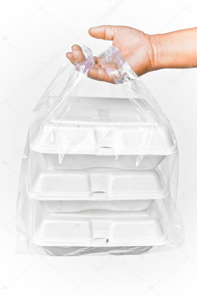 holding a clear plastic bags