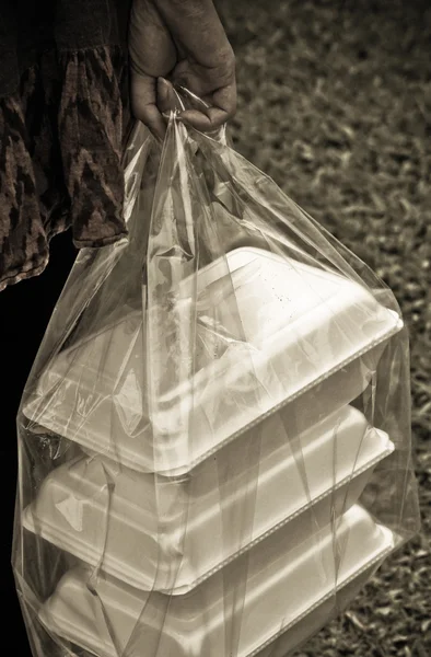 Hand holding a clear plastic bags — Stock Photo, Image
