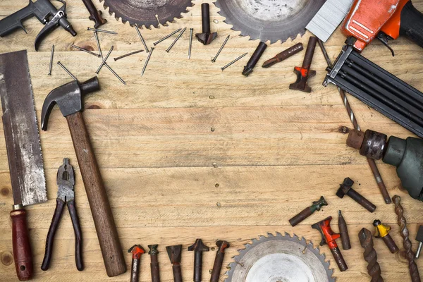 Wooden table with many types of tools — Stock Photo, Image