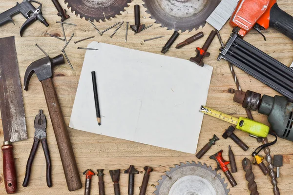 Wooden table with many types of tools — Stock Photo, Image