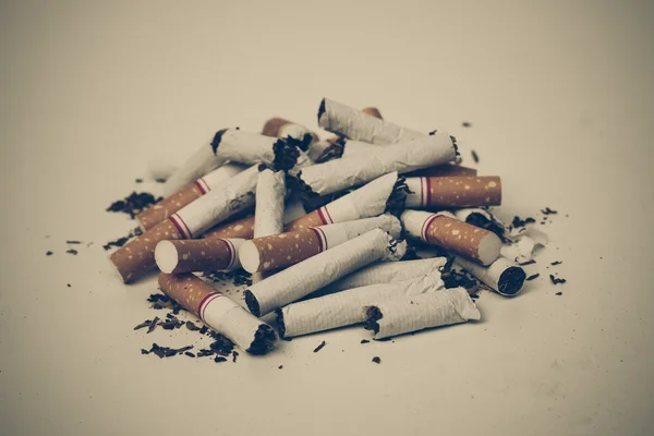 Destroyed cigarettes with sad tone — Stock Photo, Image