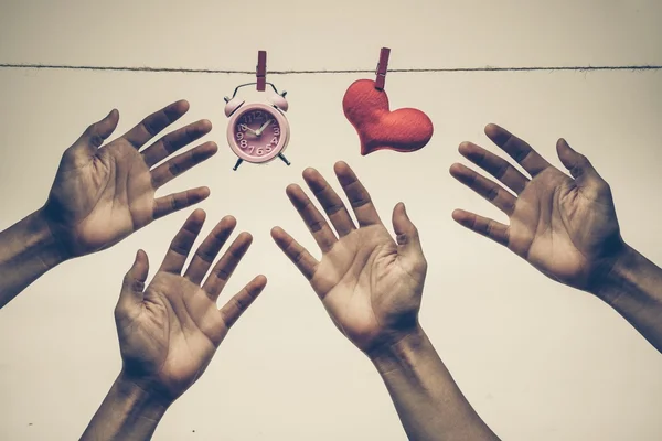 Hands fighting to reach — Stock Photo, Image