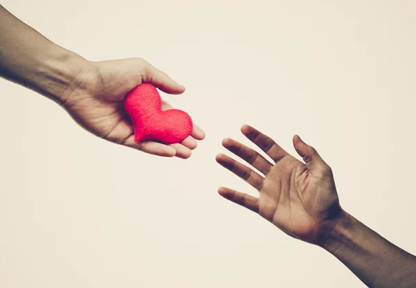 Red heart to other people — Stock Photo, Image