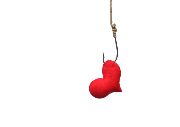 stock image red heart with a fish hook