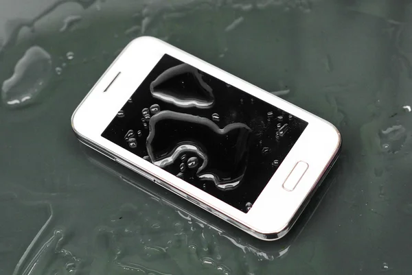 A wet white smartphone — Stock Photo, Image