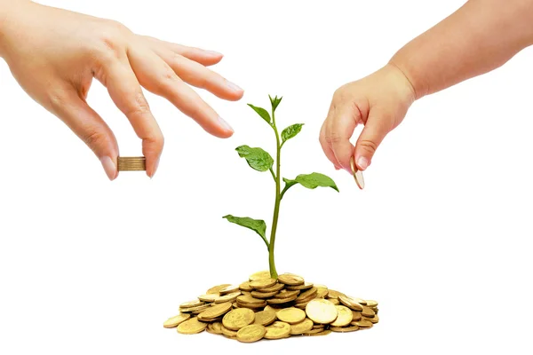 Baby giving a golden coin — Stock Photo, Image