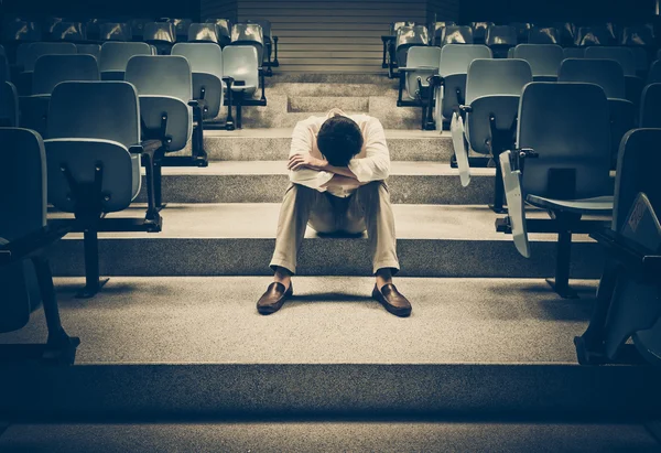 Businessman sitting desperately — Stock Photo, Image