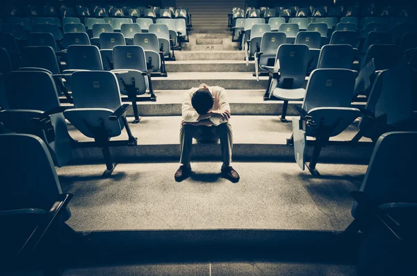 Businessman sitting desperately — Stock Photo, Image