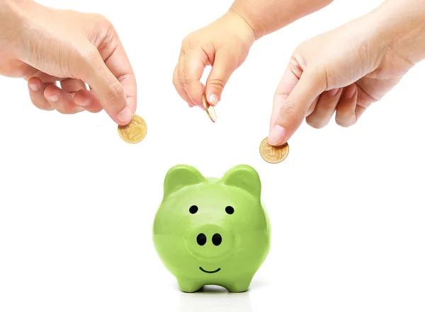 People in the family doing saving money in a pink piggybank Royalty Free Stock Images