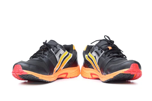Laufschuhe in den Farben schwarz und orange — Stockfoto