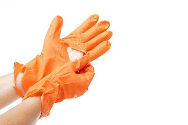 Hand wearing torn plastic protective glove — Stock Photo, Image