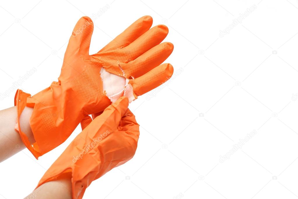 hand wearing torn plastic protective glove