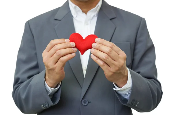 Empresario sosteniendo un corazón rojo — Foto de Stock