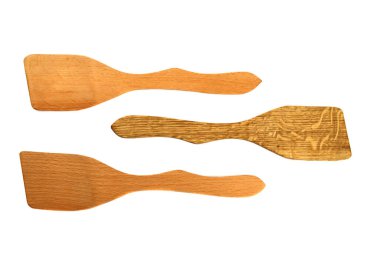 Wooden kitchen spatulas isolated on white background