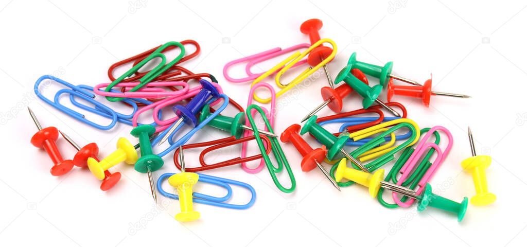 colored stationery buttons and paper clips isolated on white