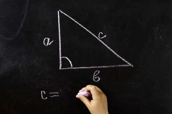 stock image Maths, geometry formula written by chalk on the blackboard background