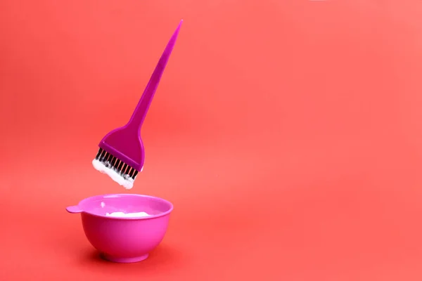 Brush Levitating Plastic Bowl Hair Dye Red Background Copy Space — Stock Photo, Image