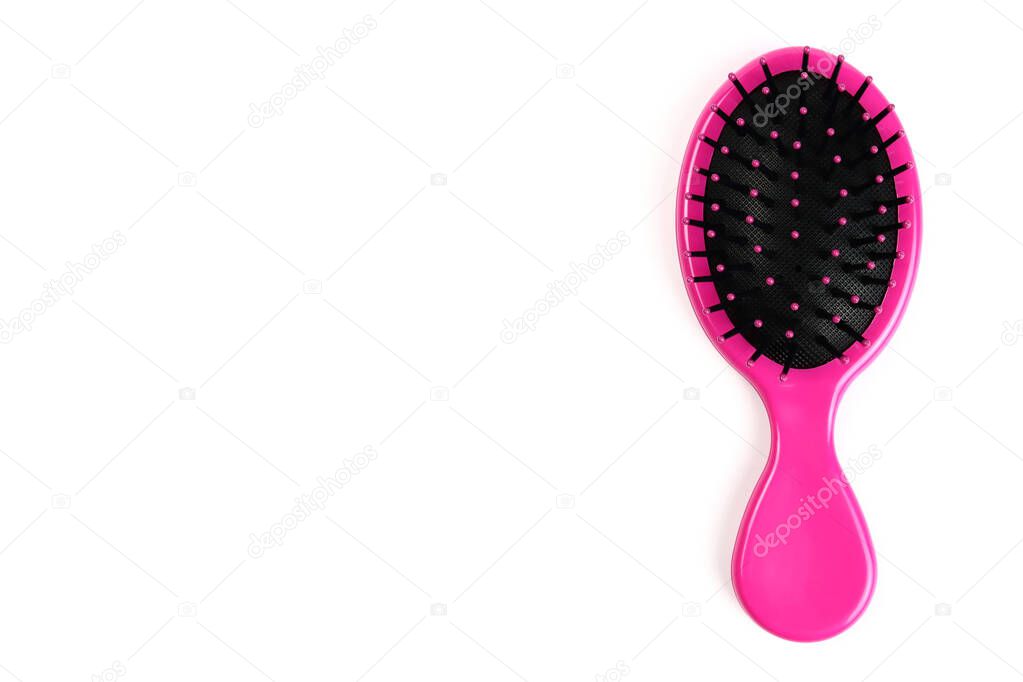 Plastic massage hair brush isolated on white background. Copy space for text