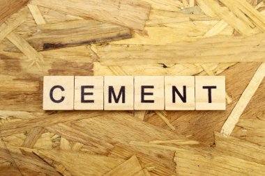 Devekuşu arka planındaki tahta bloklardan yapılmış kelime çimentosu
