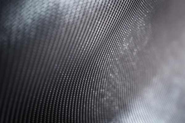 Soyut karanlık backgroud sığ derinliği alan karbon fiber metin