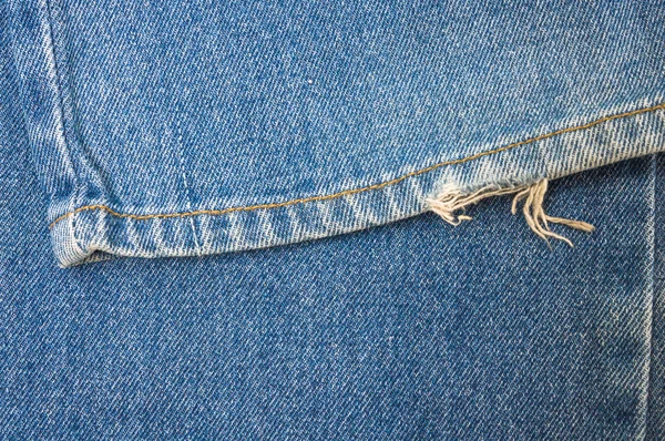 Nära håll jeans bakgrundsstruktur — Stockfoto