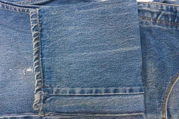 Nära håll jeans bakgrundsstruktur — Stockfoto