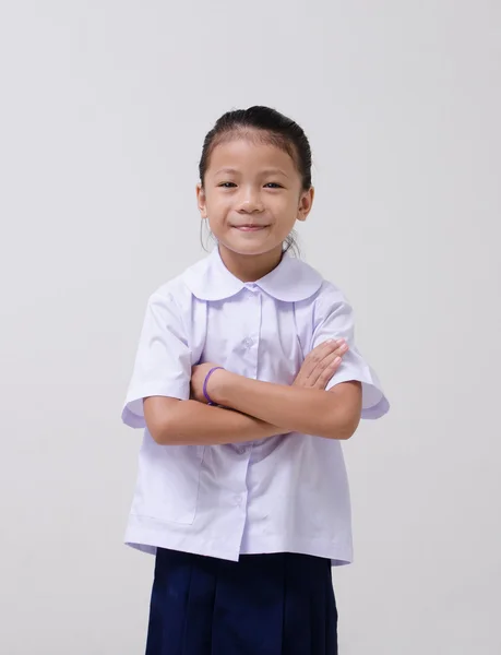 Ásia crianças bonito menina no estudante 's uniforme no branco fundo — Fotografia de Stock