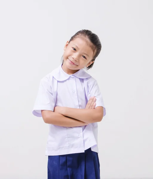 Ásia crianças bonito menina no estudante 's uniforme no branco fundo — Fotografia de Stock