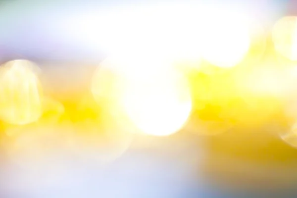 गोल्डन कलर अमूर्त धुंधला छवि पृष्ठभूमि बनावट स्टॉक तस्वीर