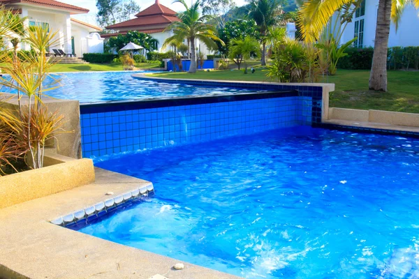 Modern Swimming pool relaxing time Stock Picture