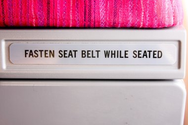 Text description backside airplane seat