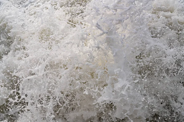 Textured background in the form of sea foam and water