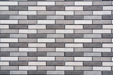 Soyut bir arkaplan olarak gri tuğla duvar