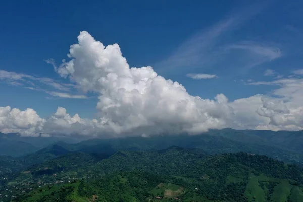 view of mountains and blue sky from drone