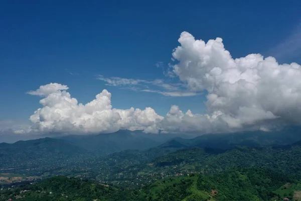 view of mountains and blue sky from drone