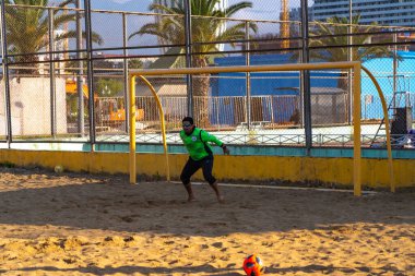 Batumi, Georgia - May 20, 2021: Goalkeeper jumps after the ball on a sandy field