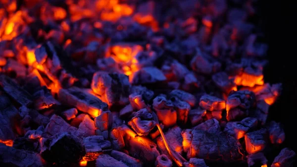 Bright embers on a black background