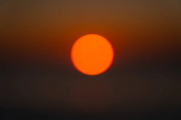 sunset on the Black Sea in June, the sun is out of focus