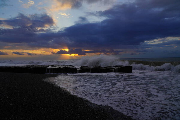 waves at sea during sunset