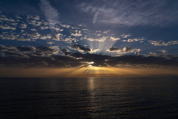 Magnificent sunset on the sea, sun rays