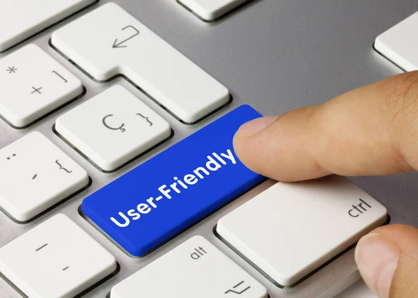 User Friendly Written Blue Key Metallic Keyboard Finger Pressing Key — Stock Photo, Image
