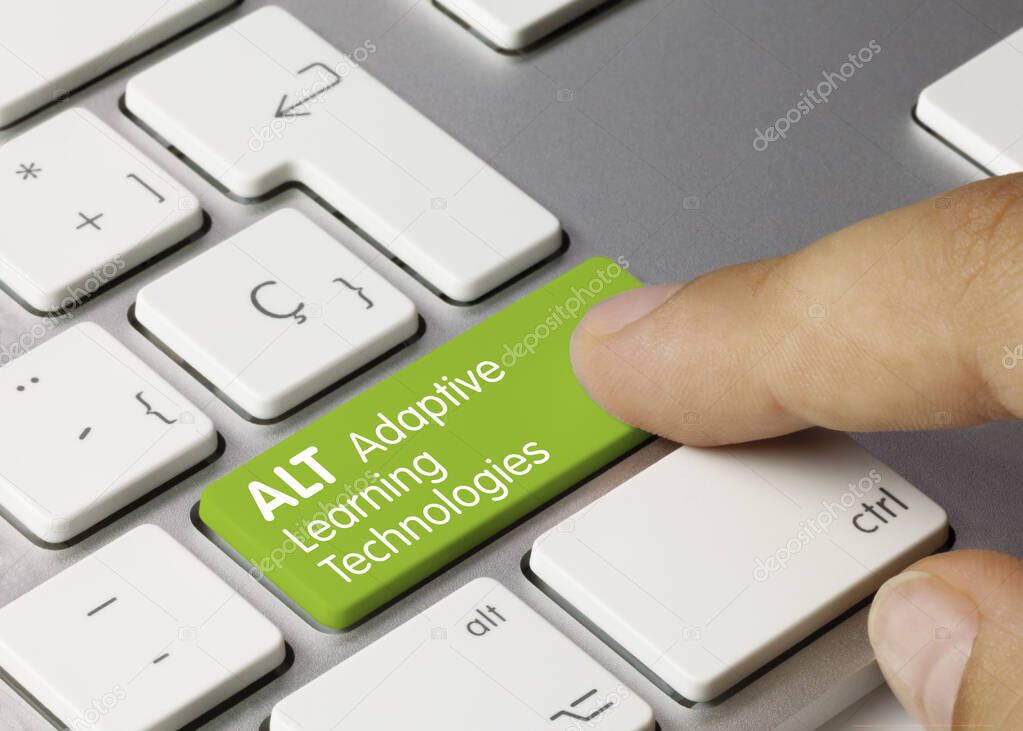 ALT Adaptive Learning Technologies Written on Green Key of Metallic Keyboard. Finger pressing key.