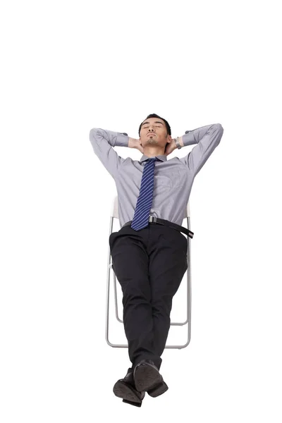 A cheerful young business man sitting posture — Stock Photo, Image