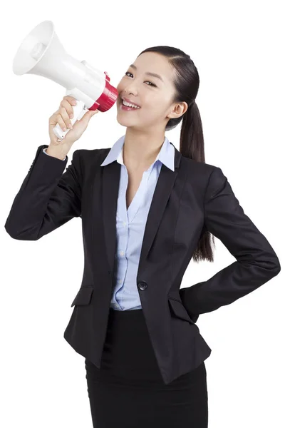 Portrait of a business woman yelling into megaphone — Stock Photo, Image