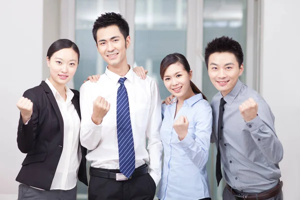 Group of happy young business people cheering — Stock Photo, Image