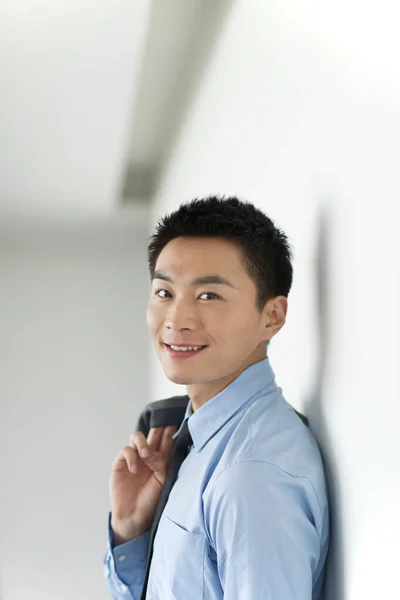 Portrait of young business man in corridor — Stock Photo, Image